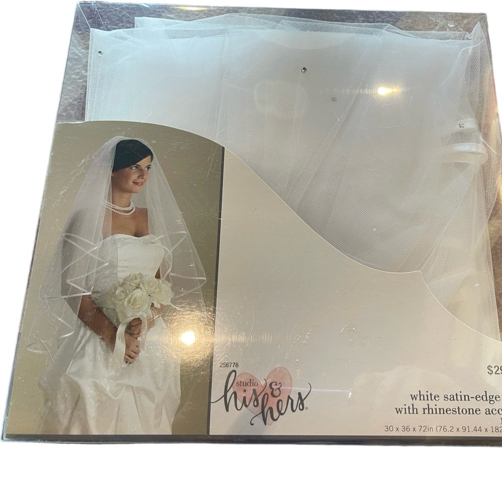 White satin-edged veil with rhinestone accents.